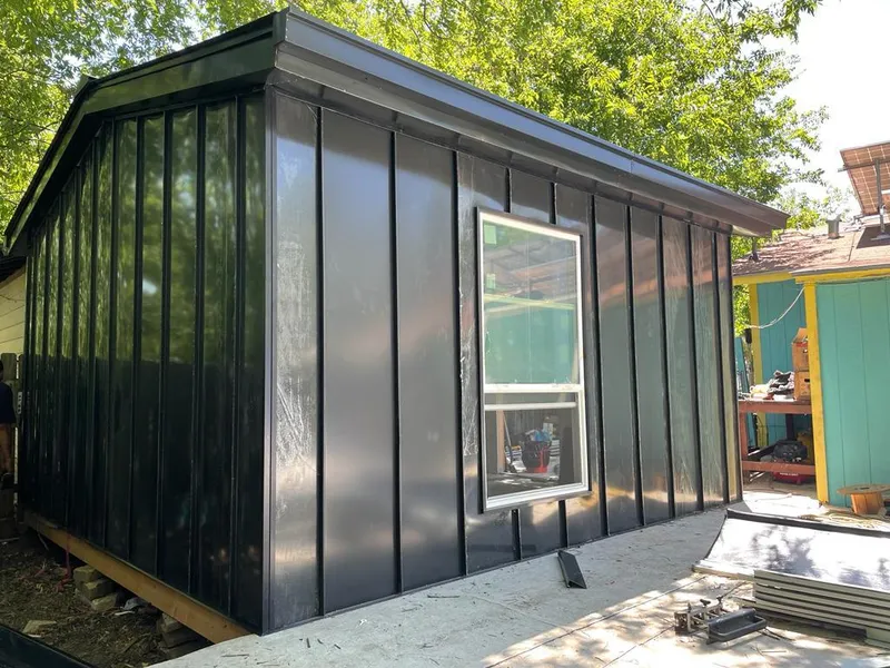 Black standing seam metal wall panels for Metal Roof Installation in Fall River